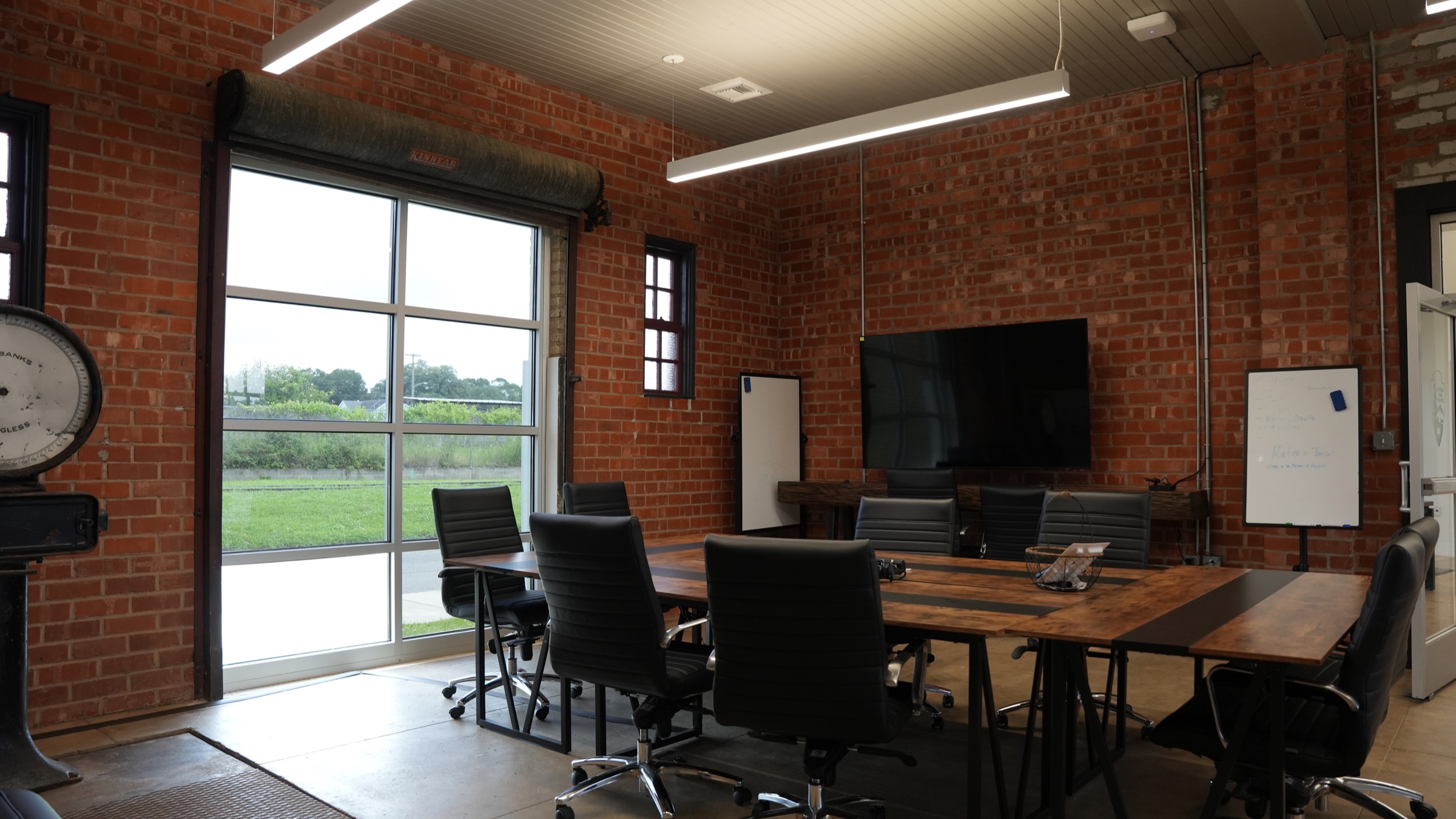 Conference room with exposed brick inside the railroad depot