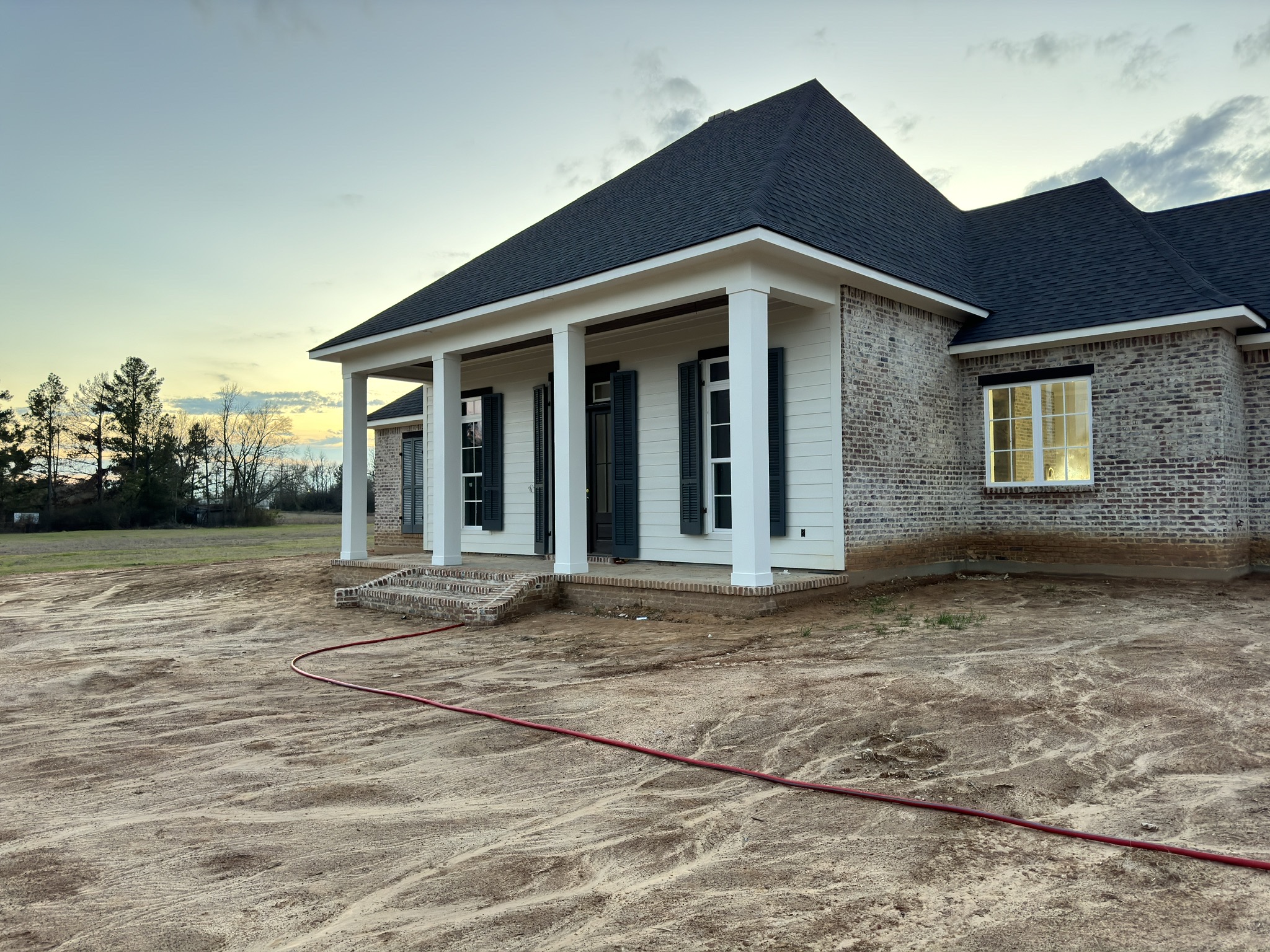 Front exterior of the residential project at sunset