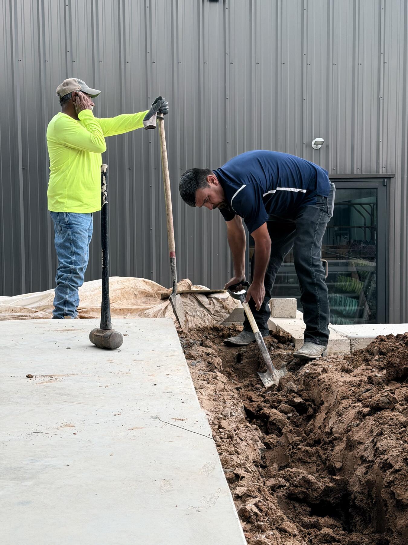 Crew completing exterior site work at All Hours Fitness